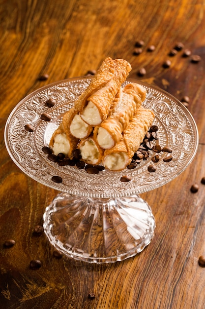 Typical sicilian pastries called cannoli with amarena listed in pastry on the plate