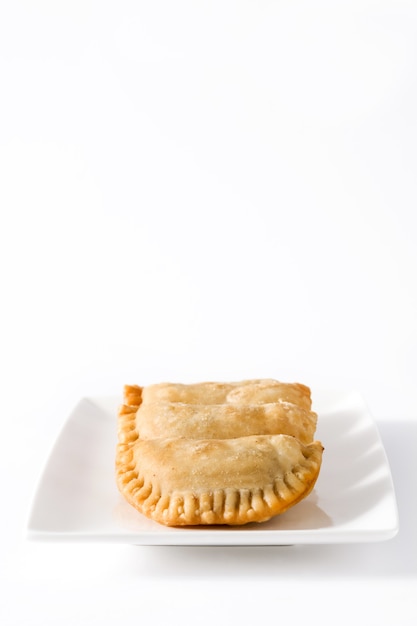 Typical Spanish empanadas on white