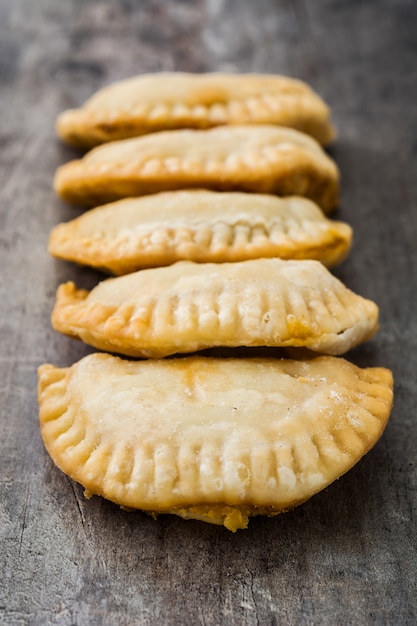 Typical Spanish empanadas on wooden table