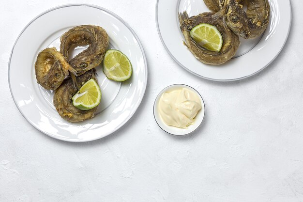 Typical Spanish frying of fried fish with lemon