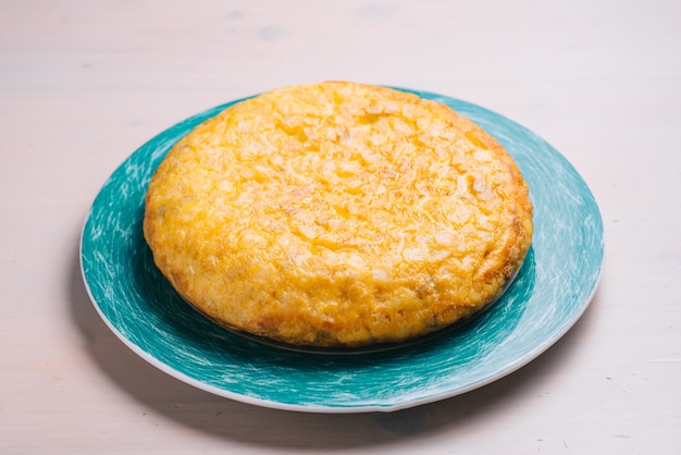 Typical spanish  omelette with potatoes on a plate