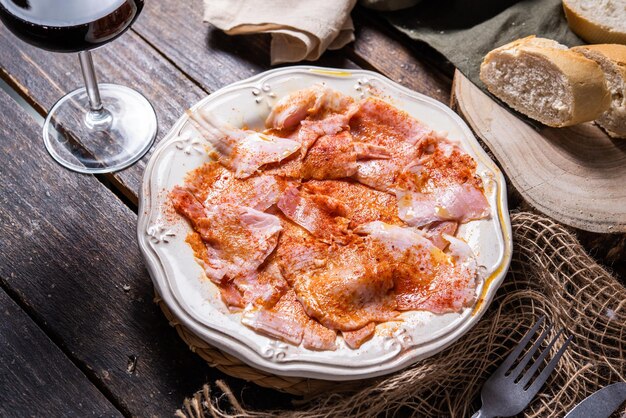 Typical Spanish tapa Galician cut pork with potatoes paprika and olive oil Appetizer lunch or dinner