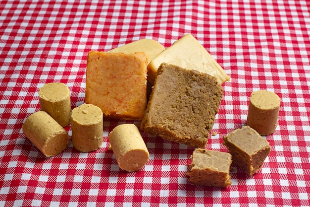 Photo typical sweets from the brazilian june festival candies with peanuts dulce de leche and pumpkins