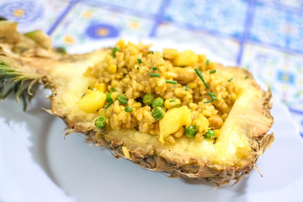 Typical Thai recipe Pineapple rice served in it is own pineapple