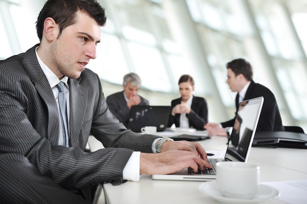 Typing report on laptop during the meeting