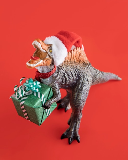 Photo tyrannosaurus rex holding gift box