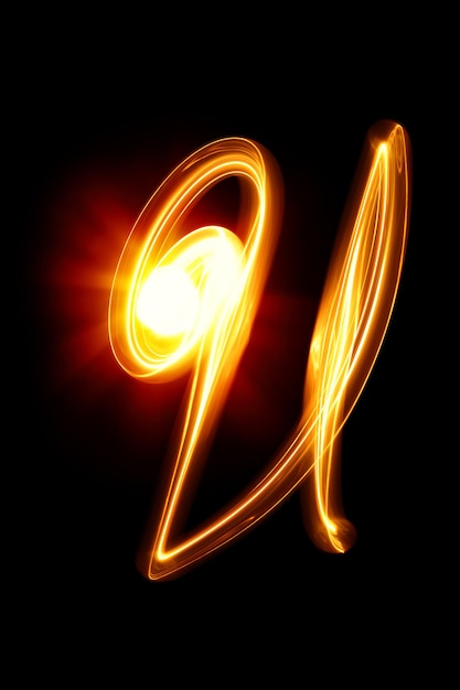 Photo u - created by light alphabet over black background