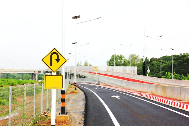 U-turn traffic sign on road warning safety drive