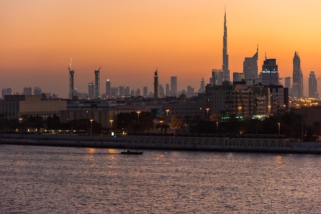 UAE, DUBAI - DECEMBER 27: view of Dubai cityscape from Dubai creek bank at night on December 27, 2014