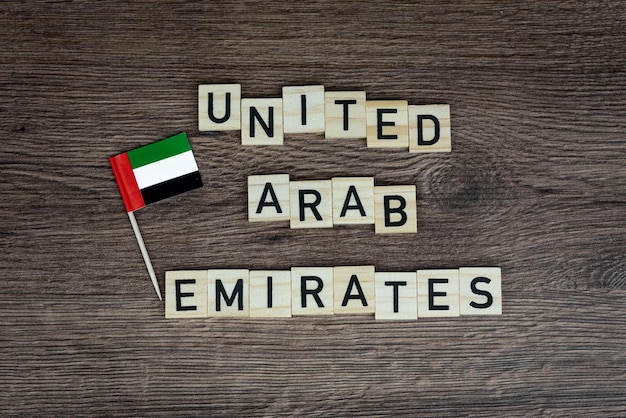 Photo uae - wooden word with emirates flag (wooden letters, wooden sign) - united arab emirates