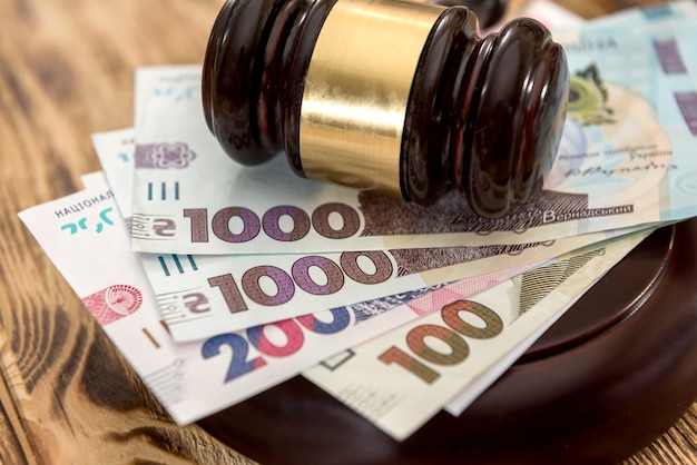 Uah, ukraine money with wooden gavel, law concept