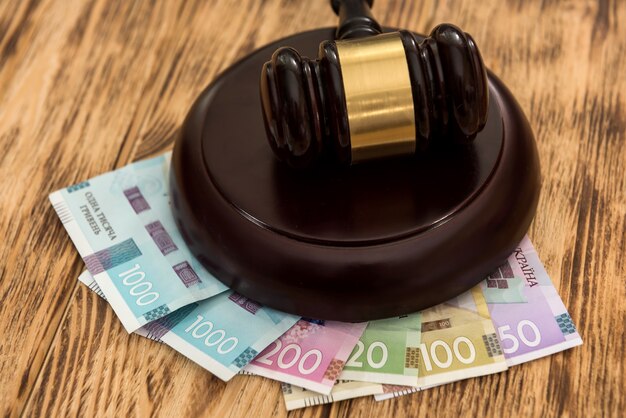 Uah, ukraine money with wooden gavel, law concept