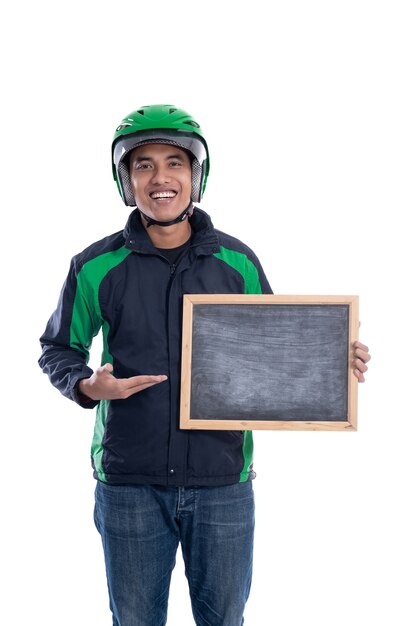 Uber driver or commercial motorbike taxi rider holding blank board and smiling