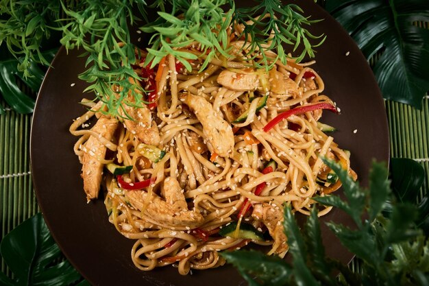 Udon noodles with chicken and peppers Japanese cuisine Top view