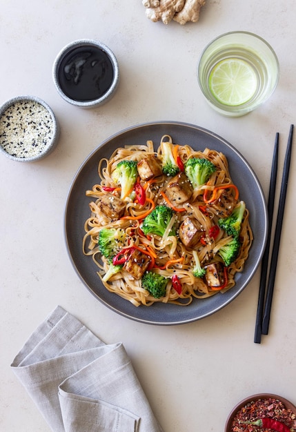 Udon noodles with tofu broccoli carrots pepper and sesame\
healthy eating vegetarian food asian food