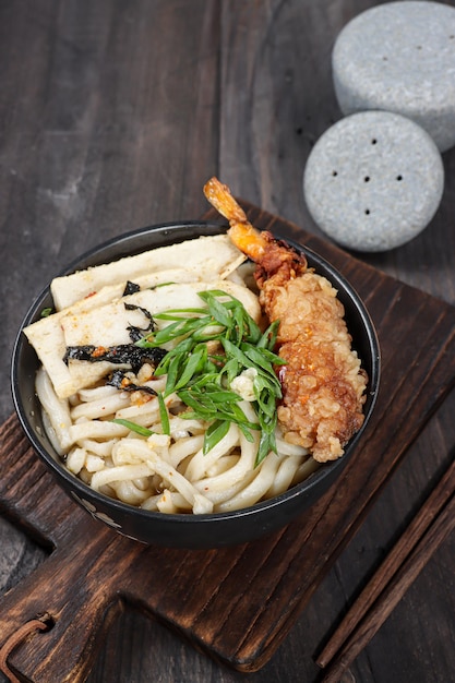 Udon udang or Japanese tempura udon noodles in a bowl