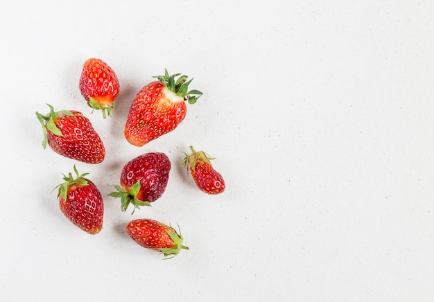 Ugly organic fresh strawberries isolated