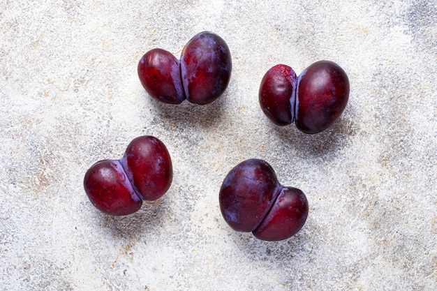 Ugly plums. Abnormal organic fruit