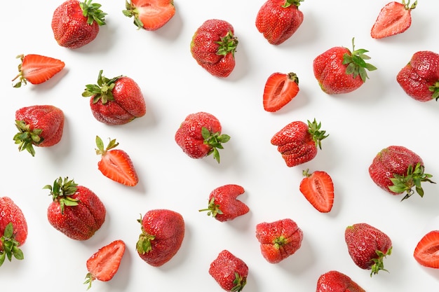 Ugly ripe organic strawberry on white background