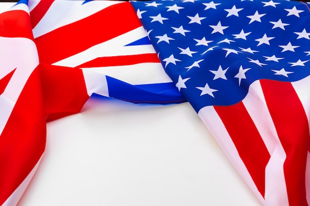 UK flag and USA flag on white