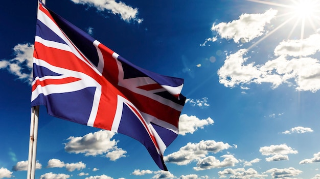 Uk, united kingdom, union jack flag waving in sky