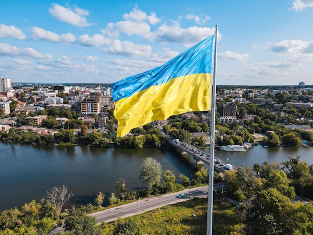 Ukraine flag on background of panoramic provincial country town Vinnitsa beautiful city with river