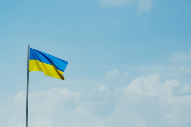 Ukraine flag on the blue sky 3d rendering