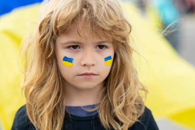 Ukraine flag on children cheeks human protest