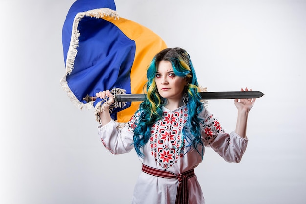 Ukraine girl with a sword with blue and yellow hair in an
embroidered shirt on a white background idea of ukrainian war