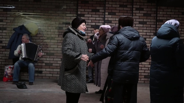 Ukraine Kyiv August 23 2022 Elderly people dance on the dance floor in groups A happy active group of Ukrainian seniors got together to dance in a public place