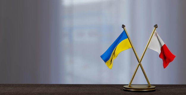 Флаги Украины и Мальты на столе Переговоры между Мальтой и Украиной