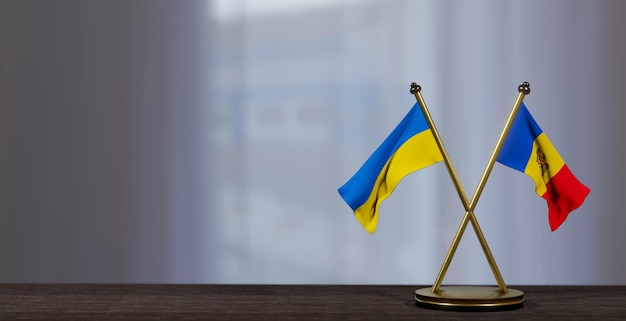 Флаги Украины и Молдовы на столе Переговоры между Молдовой и Украиной