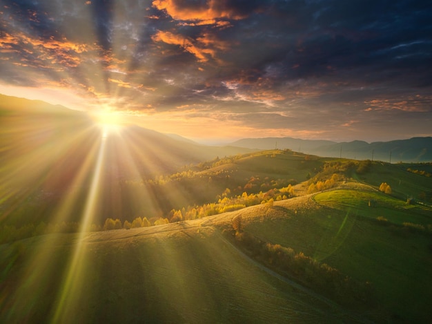 Ukraine Sunrise shines in the Carpathians colored fog spreads over the valleys and lowlands of the mountain range golden prairies are very dazzlingly beautiful