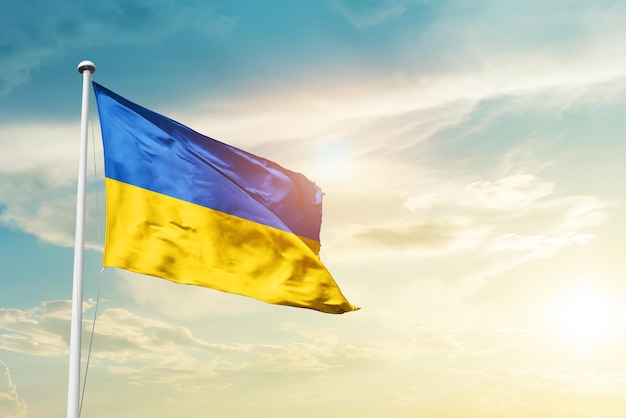 Ukraine waving flag in beautiful sky.