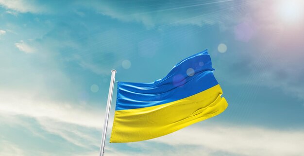 Ukraine waving flag in beautiful sky.