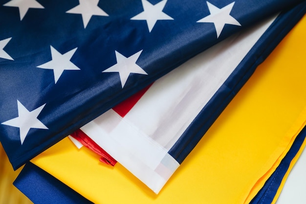 Ukrainian and American flag closeup View from above