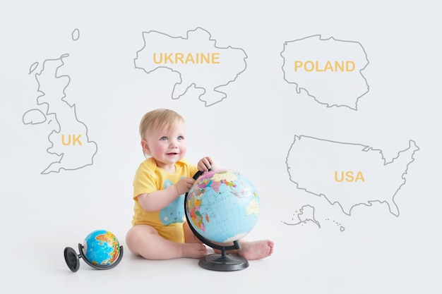 Ukrainian baby with globe Earth Day Travel and education Early child development Higher Education Partner countries of Ukraine UK USA Poland