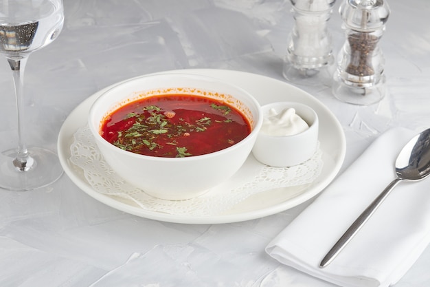 Ukrainian beet soup, borscht, light background