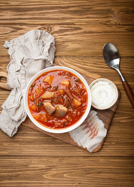 Ukrainian borscht red beetroot soup with meat in white bowl