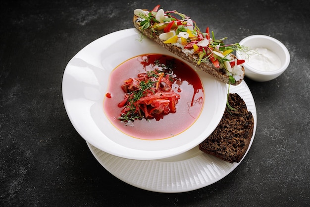 Ukrainian borscht with bruschetta with vegetables on a plate