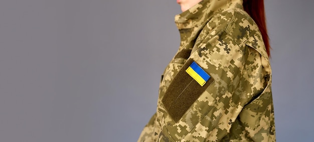 Ukrainian female in military uniform ready to defend her\
motherland armed forces of ukraine