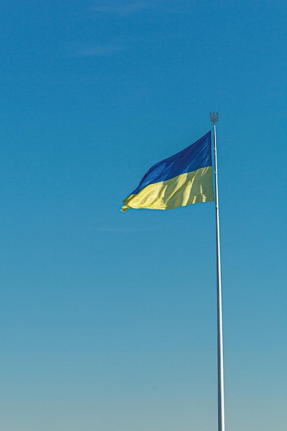 Ukrainian flag against the blue sky