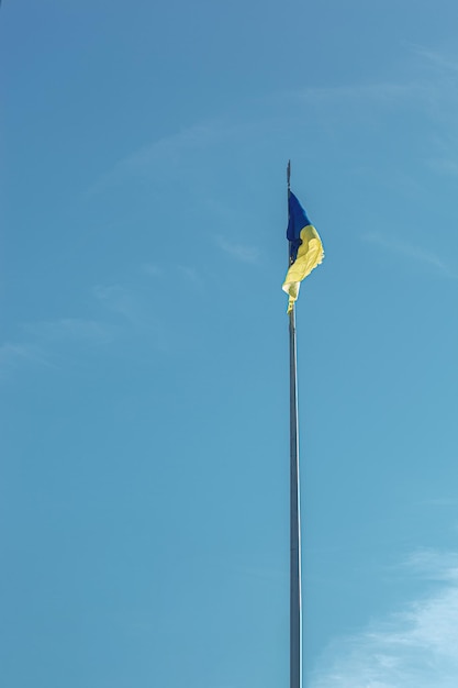 Ukrainian flag against the blue sky