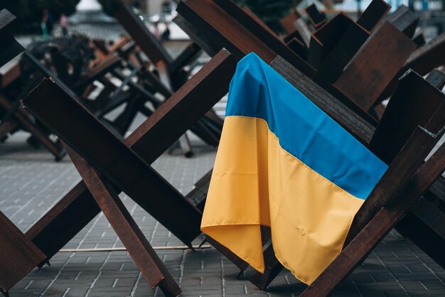 The Ukrainian flag hangs on barricades in the city