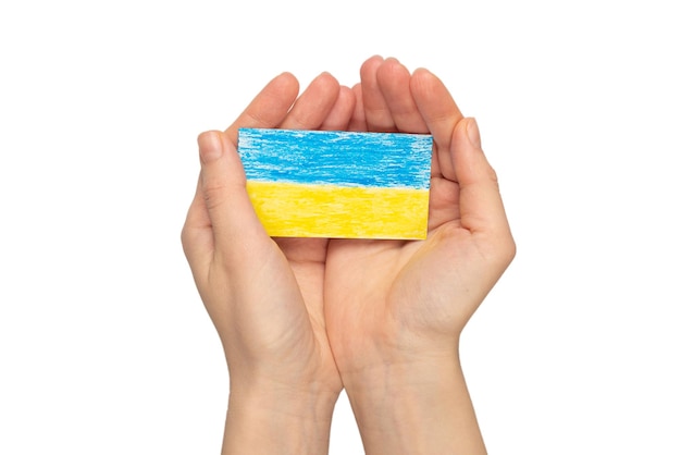Ukrainian flag in woman hands isolated on a white background Stop war