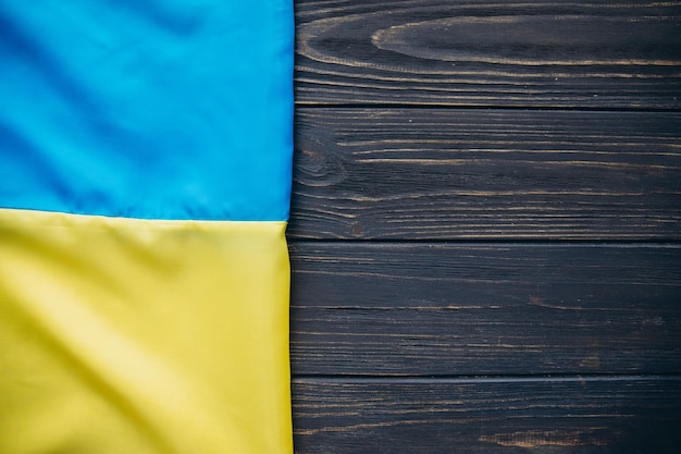 Ukrainian flag on a wooden background