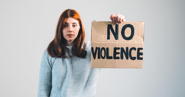 Ukrainian girl holding a no violence placard in hand