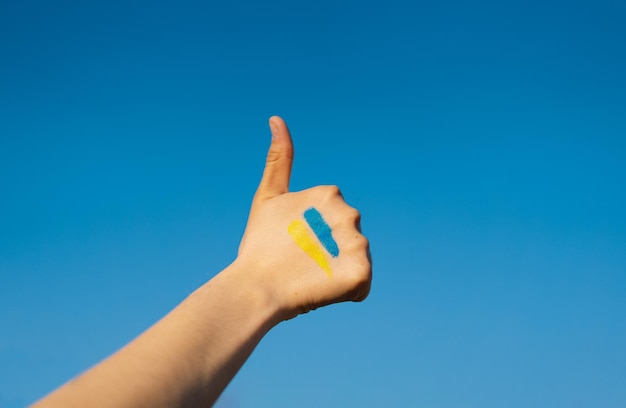 Ukrainian girl that shows a sign of thumb up sign