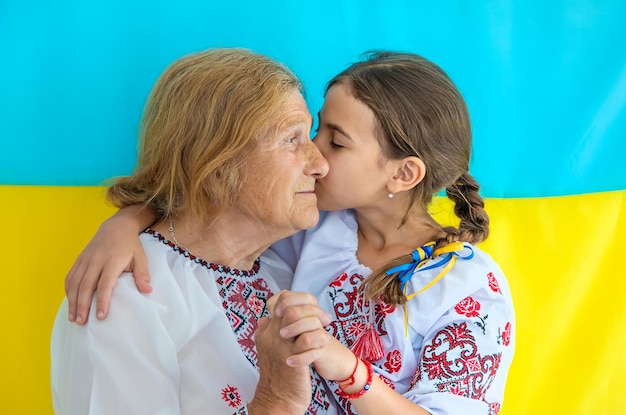 Ukrainian grandmother and granddaughter in vyshyvanka selective focus