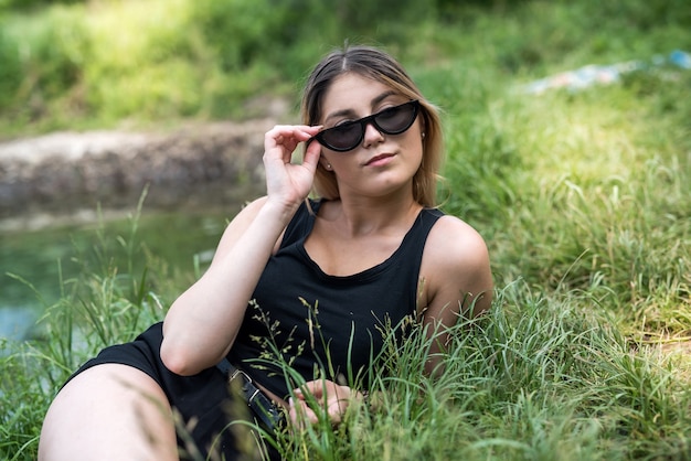 Ukrainian lady in casual clothing enjoying great weekend on lake. freedom